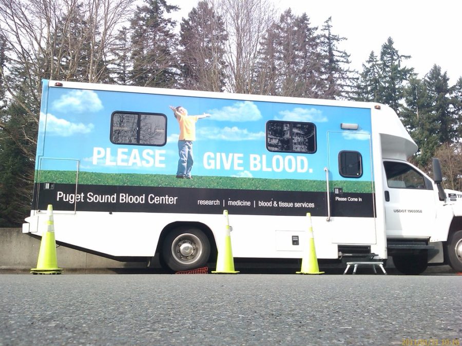 Blood drive vans travel to schools to ask students to donate blood.