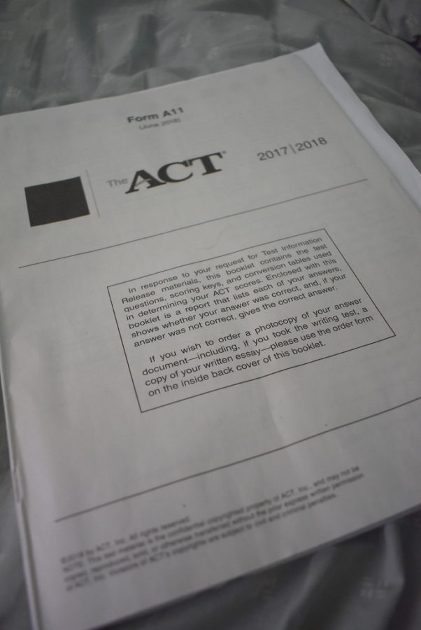 Students go through an ACT test booklet to help with getting tips.