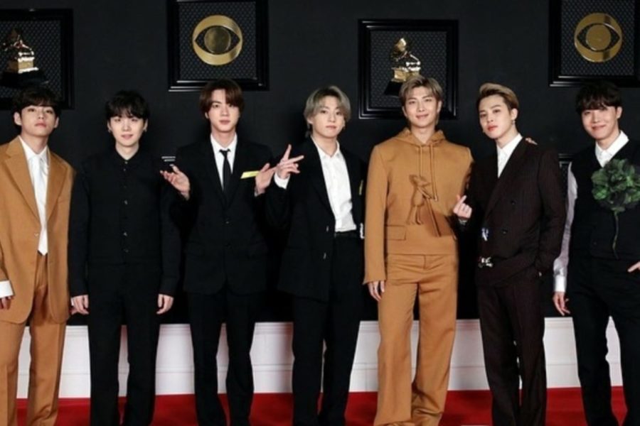 K-Pop group BTS poses on the red carpet at the 2021 Grammys