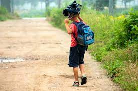 A student walks home from a successful day of summer school.