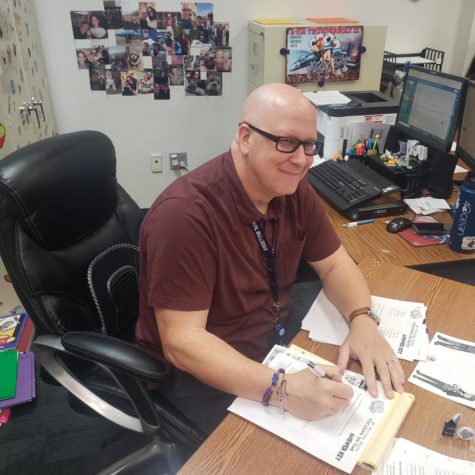 Mr. Penkalski working at his desk.