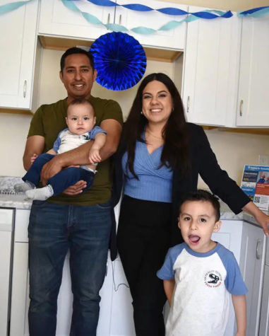 The Paredes family in their new home.
