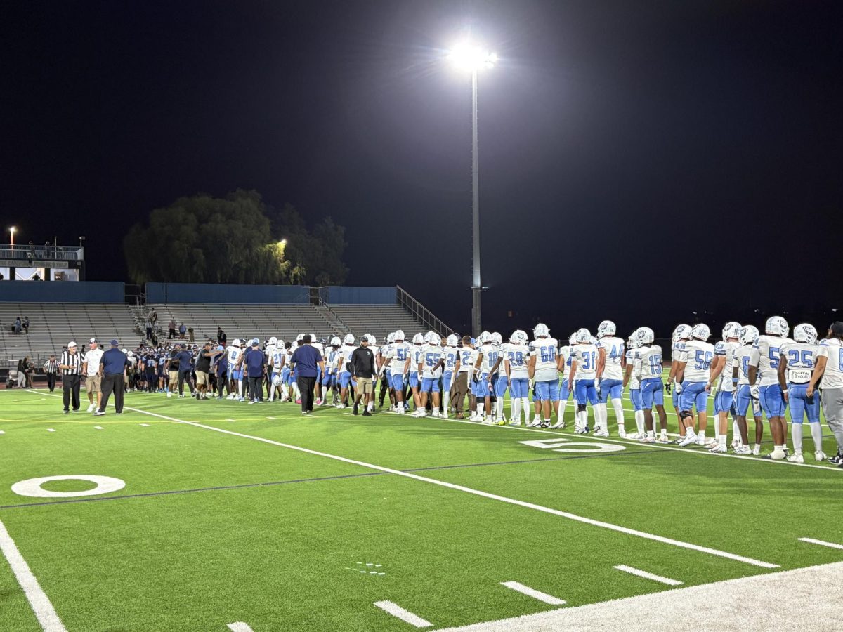 Centennial and Canyon Springs shake hands after game