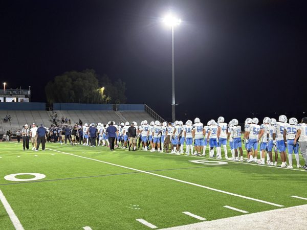 Centennial and Canyon Springs shake hands after game